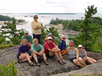 Group sitting on rocks, Benjamin Islands, North Channel